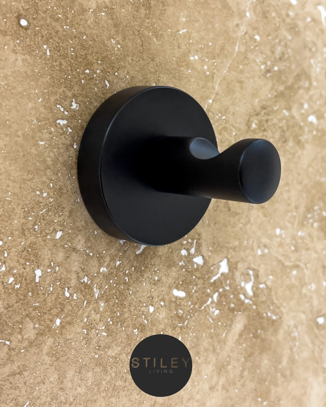 Robe hooks Black robe hook on a brick wall